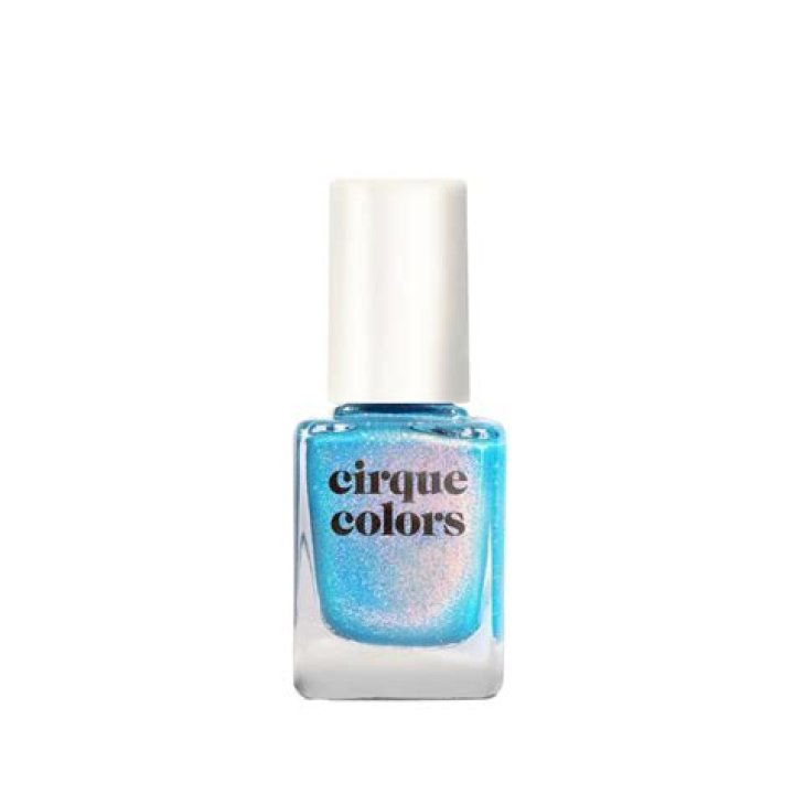 A bottle of Cirque colors dark blue creme nail polish in the shade "NYFW"