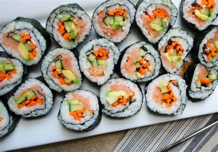 A couple makes sushi at home