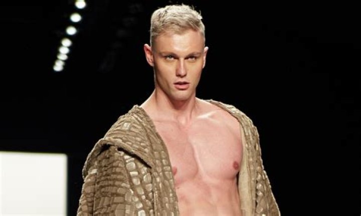 A Model Slays In A White Sophisticated Tahari Look