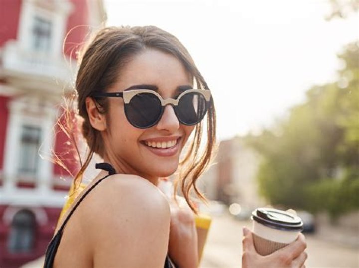 A woman in sunglasses wearing a bikini