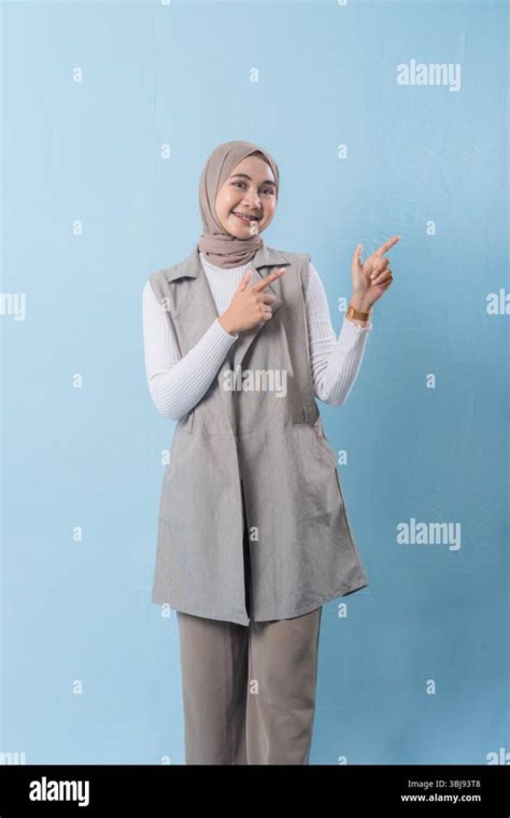 A woman wearing a grey bralette.