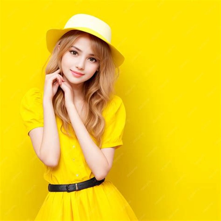A woman wearing a yellow dress.