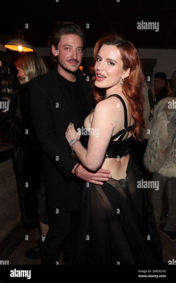 Actor Bella Thorne, right, and Mark Emms, left, pose at the "Divinity" Premiere Party At The Latinx House with Flaunt Magazine, Pop Culture Collaborative, and Entropy at The Sundance Film Festival inside the Latinx House on in Park City DIVINITY Premiere Party At The Latinx House with Flaunt Magazine, Pop Culture Collaborative, and Entropy at The Sundance Film Festival, Park City, United States - 21 Jan 2023
