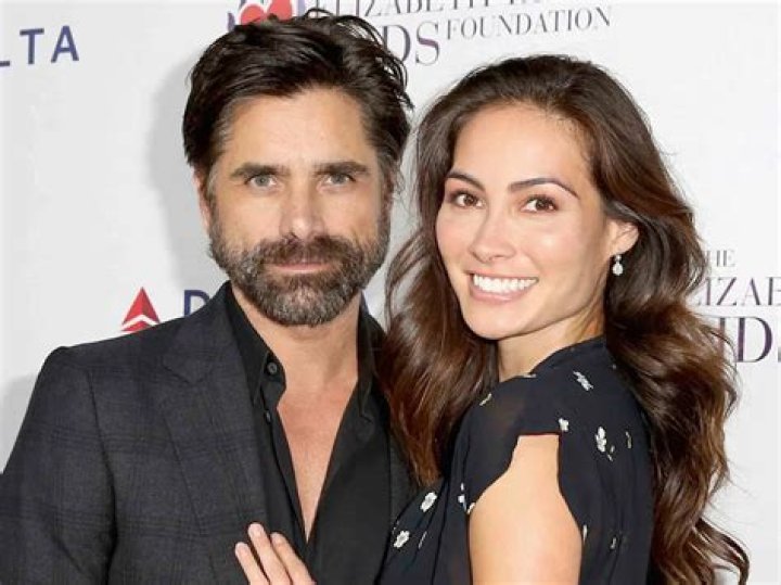Actress Caitlin McHugh and husband/actor John Stamos arrive at the Disney+ 'Turner & Hooch' Los Angeles Premiere Event held at the Westfield Century City Mall on July 15, 2021 in Century City, Los Angeles, California, United States. Disney+ 'Turner & Hooch premiere, Los Angeles, California, USA - 15 Jul 2021
