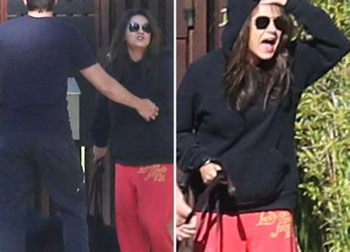 Ashton Kutcher Restrains Pregnant Mila Kunis As She Yells At Paparazzi