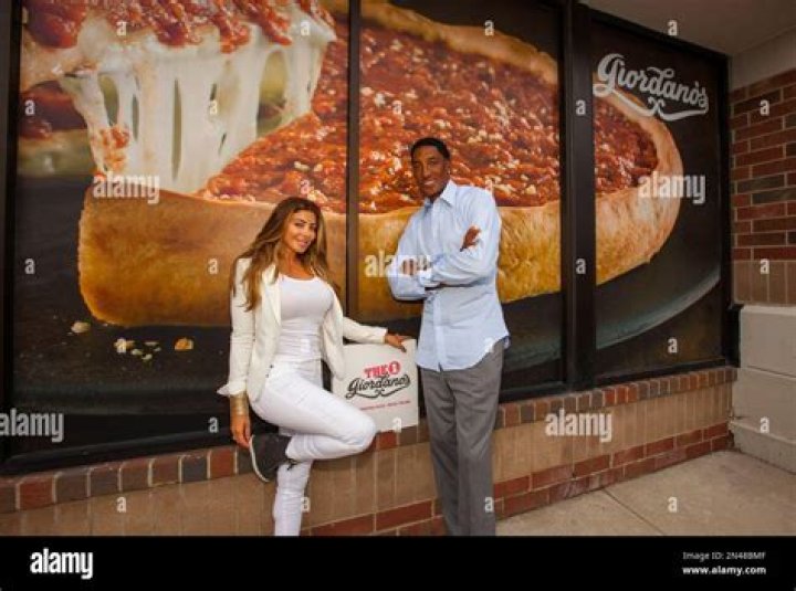Basketball legend Scottie Pippen stands with his wife Larsa Pippen, left, to announce a partnership with a Chicago pizza company, Giordano's, as it expands with its first North Shore location in Glenview, Ill., on Scottie Pippen Partners with Giordano&acirc;?&trade;s in Chicago&acirc;?&trade;s North Shore, Glenview, USA