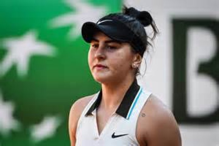 Bianca Andreescu hugs her coach after winning