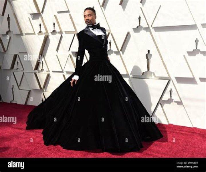 Billy Porter Wears A Black Structured Suit With Patent Leather Features