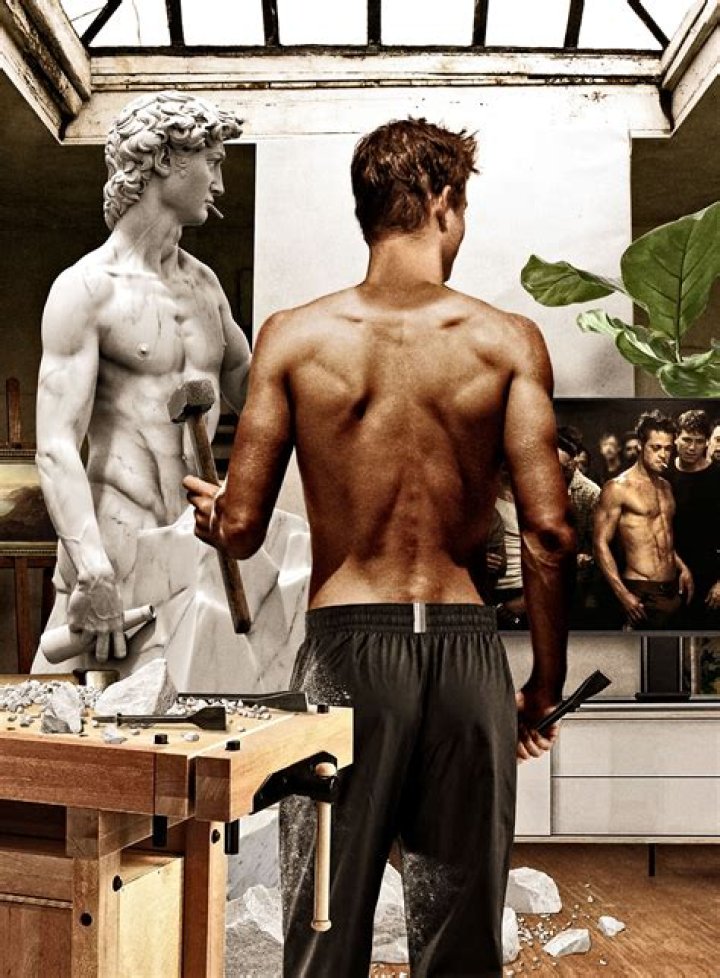 Brad Pitt Showing Muscles On A Movie Set