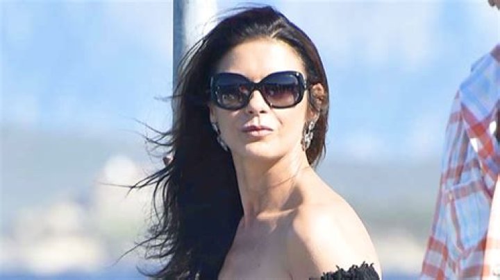 Catherine Zeta Jones Slays Plunging Swimsuit In Sexy Seflies – Hollywood Life