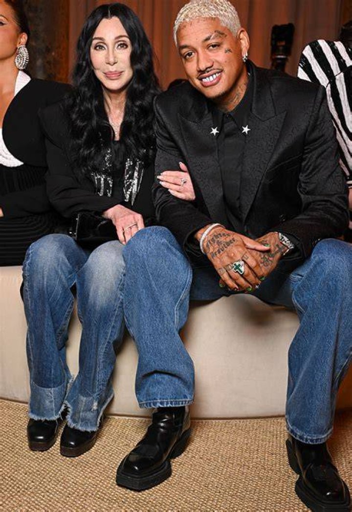 Cher, 77, Cuddles Up to Boyfriend A.E. Edwards, 38, During Rare Appearance at Paris Fashion Week: Photos