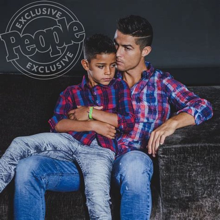 Cristiano Ronaldo and his mini-me are two peas in a pod in this very cute photoshoot for the football star&rsquo;s new CR7 Junior denim line. The 32-year-old Real Madrid player and his seven-year-old son, Cristiano Ronaldo Jr, pose up a storm, flexing their muscles while shirtless and donning matching outfits. The CR7 Junior collection is available exclusively on CR7.com and markets itself as the &ldquo;future of denim&rdquo; with &ldquo;unrivaled mobility&rdquo;. Speaking about the new line, Ronaldo explained: &ldquo;For me, the CR7 Junior collection is all about having fun and being free, being creative and confident. &ldquo;The stretch denim we have used in the collection is extremely comfortable due to the technical elements in the fabric, which will allow boys to&nbsp;run around and be active, move freely and most importantly, play.&rdquo; Ronaldo &mdash; who is also father to four-month-old twins Mateo and Eva Maria and whose girlfriend Georgina Rodriguez is pregnant with his fourth child &mdash; went on: &ldquo;This is why we have used the PRESS PLAY tagline for the brand. &ldquo;I believe the youth of today are the ones driving the society forward in so many ways and I felt that creating a denim collection&nbsp;with my son would celebrate&nbsp;this.&rdquo;. 14 Nov 2017 Pictured: Cristiano Ronaldo and his son Cristiano Ronaldo Jr. pose together in a photoshoot for the Real Madrid star's new CR7 Junior denim line. Photo credit: CR7/ MEGA TheMegaAgency.com +1 888 505 6342 (Mega Agency TagID: MEGA116703_002.jpg) [Photo via Mega Agency]