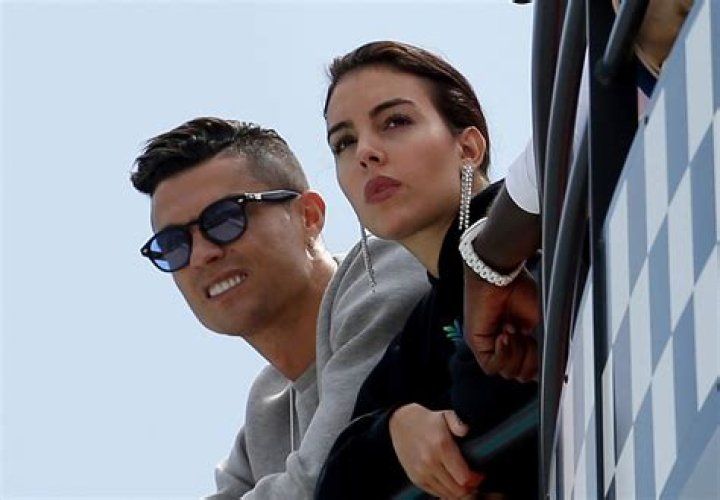 Cristiano Ronaldo, left, is flanked by his partner Georgina Rodriguez as they watch the second practice session at the Monaco racetrack, in Monaco, . The Formula one race will be held on Sunday F1 GP Auto Racing, Monaco, Monaco - 23 May 2019