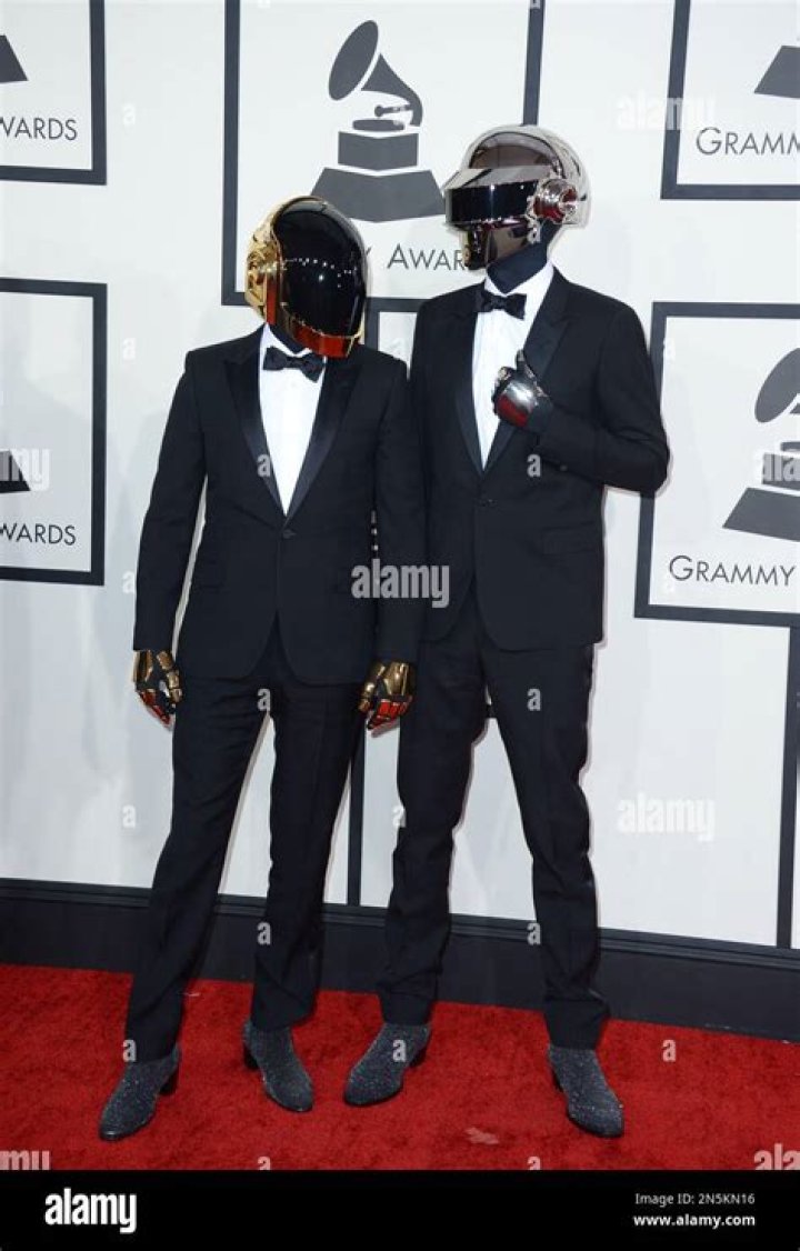 Daft Punk arrives at the 56th annual GRAMMY Awards at Staples Center on Sunday, Jan. 26, 2014, in Los Angeles. (Photo by Jordan Strauss/Invision/AP)
