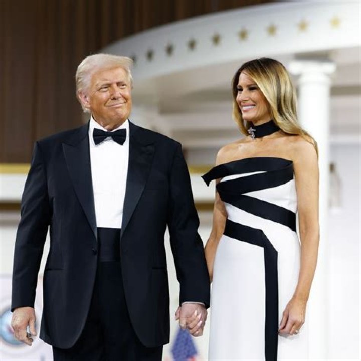 Donald Trump And Melania Trump Pictured With An Election Worker