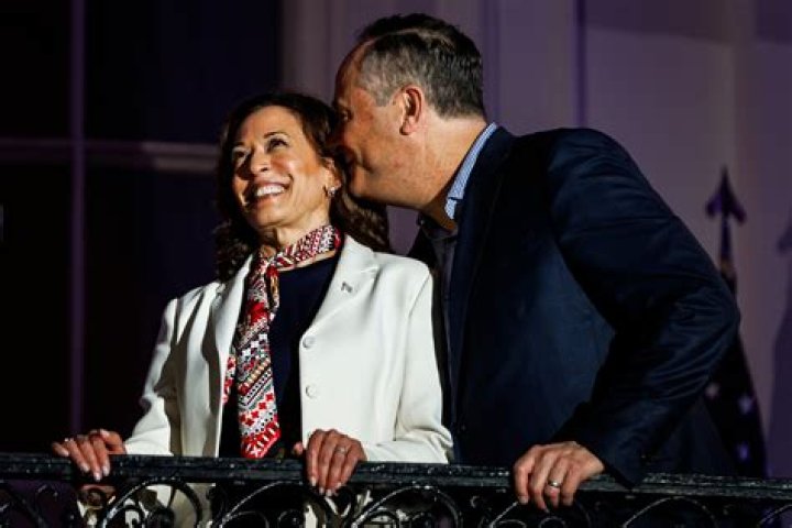 Douglas Emhoff, left, husband of U.S. Sen. Kamala Harris, D-California, and children Ella and Cole, stand on stage after Harris launched her presidential campaign at a rally in her hometown of Oakland, Calif., Sunday, Jan. 27, 2019. (AP Photo/Tony Avelar)