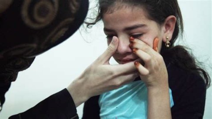 Dr. Amani comforts a young girl