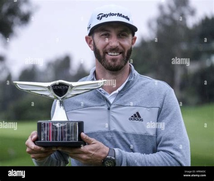 Dustin Johnson celebrates with his partner Paulina Gretzky on the 18th green after winning the Tour Championship golf tournament and FedEx Cup on at East Lake Golf Club in Atlanta Tour Championship Golf, Atlanta, United States - 07 Sep 2020