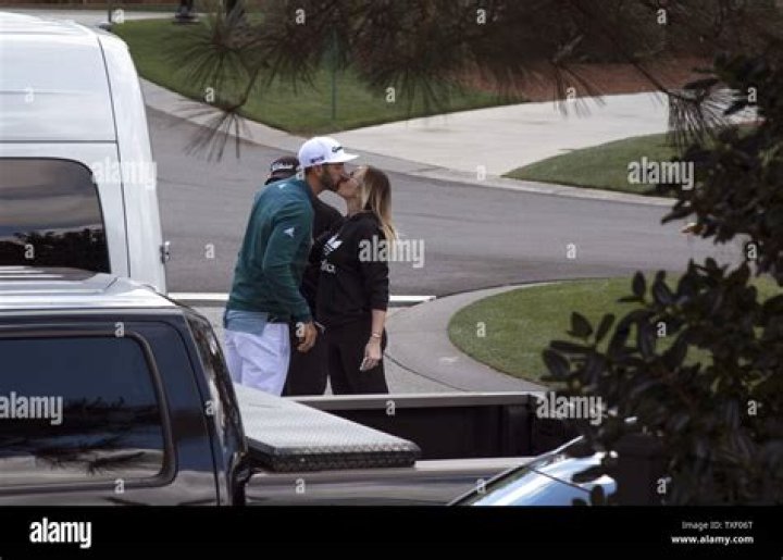 Dustin Johnson kisses Paulina Gretzky when holds the Championship Trophy on the 18th green after winning his first major championship in the final round at the U.S. Open at Oakmont Country Club near Pittsburgh, Pennsylvania on June 19, 2016. Johnson won with a score of 5 under par. U.s. Open Golf 2016, Oakmont, Pennsylvania, United States - 19 Jun 2016