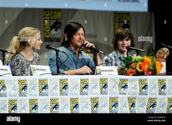 Emily Kinney, left, and Norman Reedus attend "The Walking Dead" panel on Day 2 of Comic-Con International, in San Diego. Looking on from left are Chad Coleman and Emily Kinney 2014 Comic-Con - "The Walking Dead" Panel, San Diego, USA - 25 Jul 2014