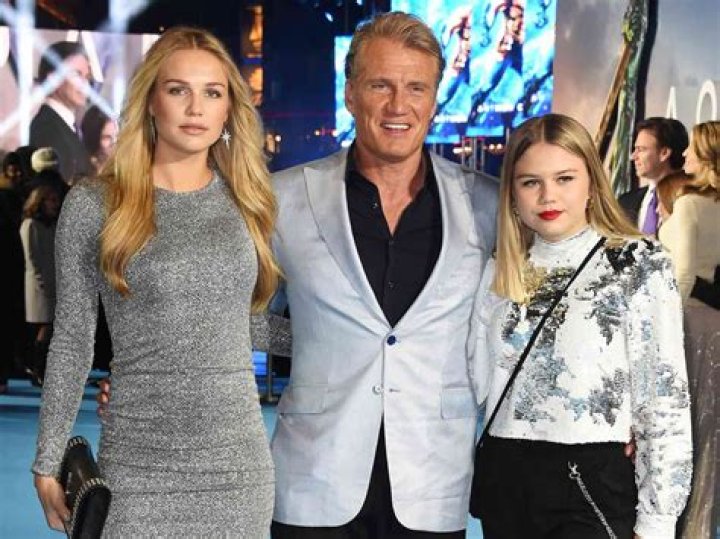 EXCLUSIVE: Swedish actor Dolph Lundgren goes shirtless during a romantic vacation in Greece with his much younger fiancee Emma Krokdal amid his lengthy cancer battle. The 65-year-old movie star and the 25-year-old Norwegian beauty were seen kissing as they enjoyed a sunsoaked break in Mykonos. The trip comes after the 'Rocky IV' star revealed he has been battling lung cancer for eight years and speculated whether his past use of steroids for bodybuilding is to blame. The couple were joined in Greece by Dolph's model daughter Ida Lundgren, 27. Despite their 40-year age gap, Dolph has spoken about how mature his lady love is for her age. 13 Jul 2023 Pictured: Dolph Lundgren, Emma Krokdal. Photo credit: A LONE WOLF/MEGA TheMegaAgency.com +1 888 505 6342 (Mega Agency TagID: MEGA1006850_001.jpg) [Photo via Mega Agency]