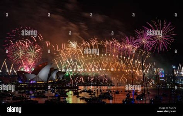 Fireworks explode over the Sydney Opera House and Harbour Bridge as New Year celebrations begin in Sydney, Australia, Thursday, Dec. 31, 2020. One million people would usually crowd the Sydney Harbor to watch the annual fireworks that center on the Sydney Harbour Bridge. But this year authorities advised revelers to watch the fireworks on television as the two most populous states, New South Wales and Victoria battle to curb new COVID-19 outbreaks. (AP Photo/Mark Baker)