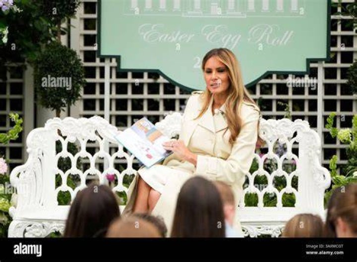 First lady Melania Trump reads a Christmas book titled, "Oliver the Ornament Meets Marley and Joan and Abbey," at Children's National Hospital, Tuesday, Dec. 15, 2020, in Washington. Due to pandemic concerns there were two children in the room and the reading was broadcast to children in the rest of the hospital. (AP Photo/Jacquelyn Martin)