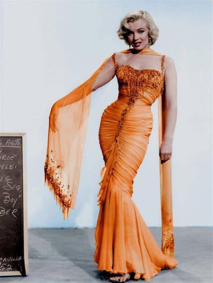 Flashes Spanx In Orange Dress – Hollywood Life