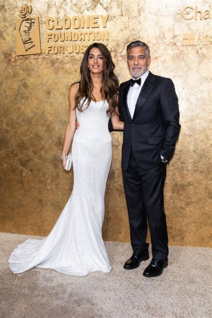 George Clooney, Amal Clooney, and children.