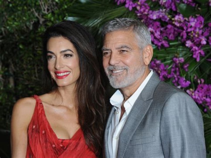 George Clooney and his wife, Amal arrive for the formal Artist's Dinner honoring the recipients of the 45th Annual Kennedy Center Honors at the Department of State in Washington, D.C. on Saturday, December 3, 2022. The 2022 honorees are: actor and filmmaker George Clooney; contemporary Christian and pop singer-songwriter Amy Grant; legendary singer of soul, Gospel, R&B, and pop Gladys Knight; Cuban-born American composer, conductor, and educator Tania Le&radic;&ge;n; and iconic Irish rock band U2, comprised of band members Bono, The Edge, Adam Clayton, and Larry Mullen Jr. Credit: Ron Sachs / Pool via CNP Pictured: George Clooney,Amal Clooney Ref: SPL5507657 031222 NON-EXCLUSIVE Picture by: Ron Sachs/CNP / SplashNews.com Splash News and Pictures USA: +1 310-525-5808 London: +44 (0)20 8126 1009 Berlin: +49 175 3764 166 World Rights, No France Rights