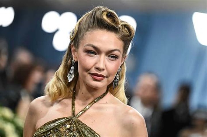 Gigi Hadid Goes Braless Under Open Pink Blazer & Shows Major Skin In Sexy Beach Shoot — Pics