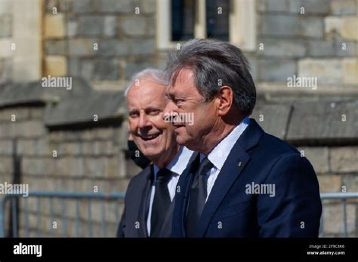 Gyles Brandreth and Alan Titchmarsh walking outside the chapel