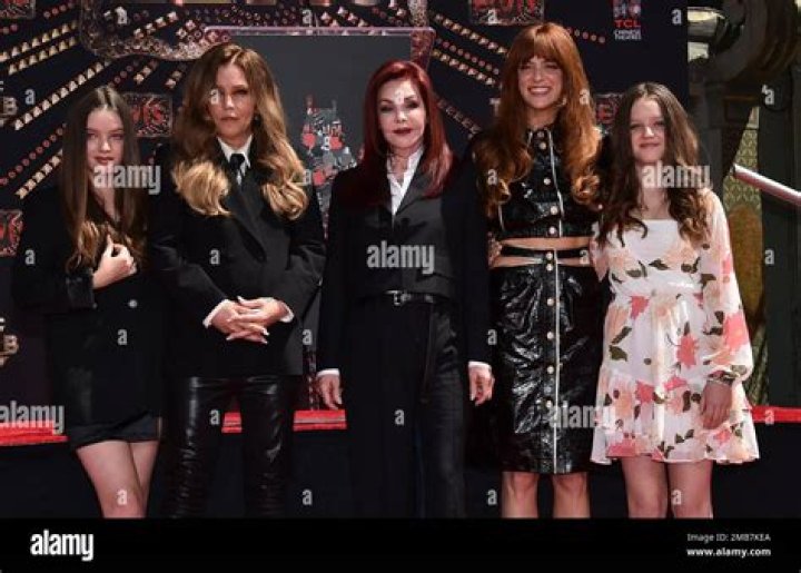 Harper Presley Lockwood, from left, Lisa Marie Presley, Priscilla Presley, Riley Keough and Finley Presley Lockwood, family members of the late singer Elvis Presley, pose after placing their hands in cement at a ceremony in honor of the Presley family, at the TCL Chinese Theatre in Los Angeles Priscilla Presley, Lisa Marie Presley and Riley Keough Hand and Footprint Ceremony, Los Angeles, United States - 21 Jun 2022