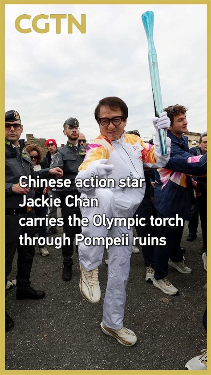Jackie Chan Carries The Olympic Torch