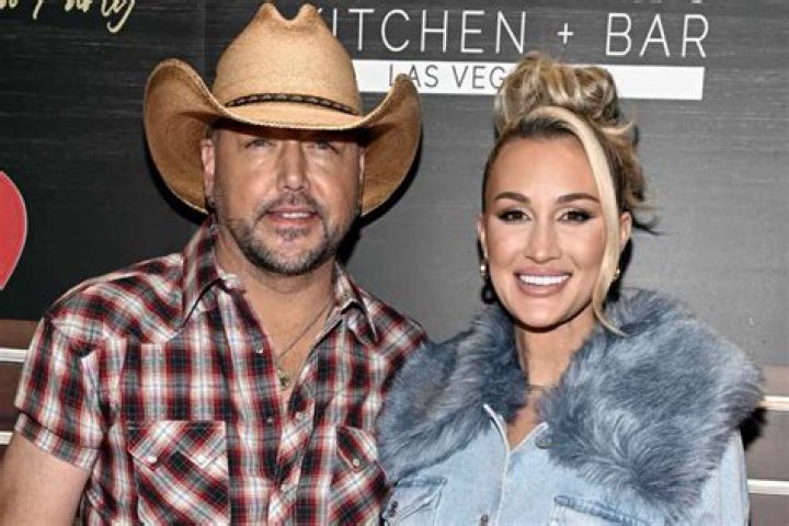 Jason Aldean, left, and Brittany Kerr arrive at the 52nd annual Academy of Country Music Awards at the T-Mobile Arena in Las Vegas. Aldean announced on May 8, 2017, that he and Kerr are expecting their first child together People Jason Aldean, Las Vegas, USA - 2 Apr 2017