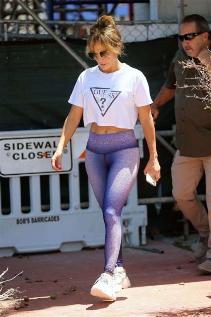 Jennifer Lopez sneaks out of Anatomy gym in Miami Beach via a side exit wearing a white Guess top and purple leggings. It seems she did not want to be spotted with her new beau Ben Affleck, who left through the main entrance. Pictured: Jennifer Lopez Ref: SPL5228728 240521 NON-EXCLUSIVE Picture by: Pichichipixx.com / SplashNews.com Splash News and Pictures USA: +1 310-525-5808 London: +44 (0)20 8126 1009 Berlin: +49 175 3764 166 World Rights
