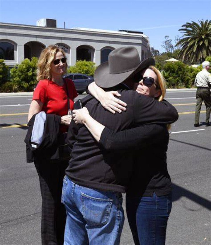 Jessica Parks, right, hugs Poway Mayor Steve Vaus outside of the Chabad of Poway Synagogue, in Poway, Calif. Several people were injured in a shooting at the synagogue Synagogue Shooting-California, Poway, USA - 27 Apr 2019