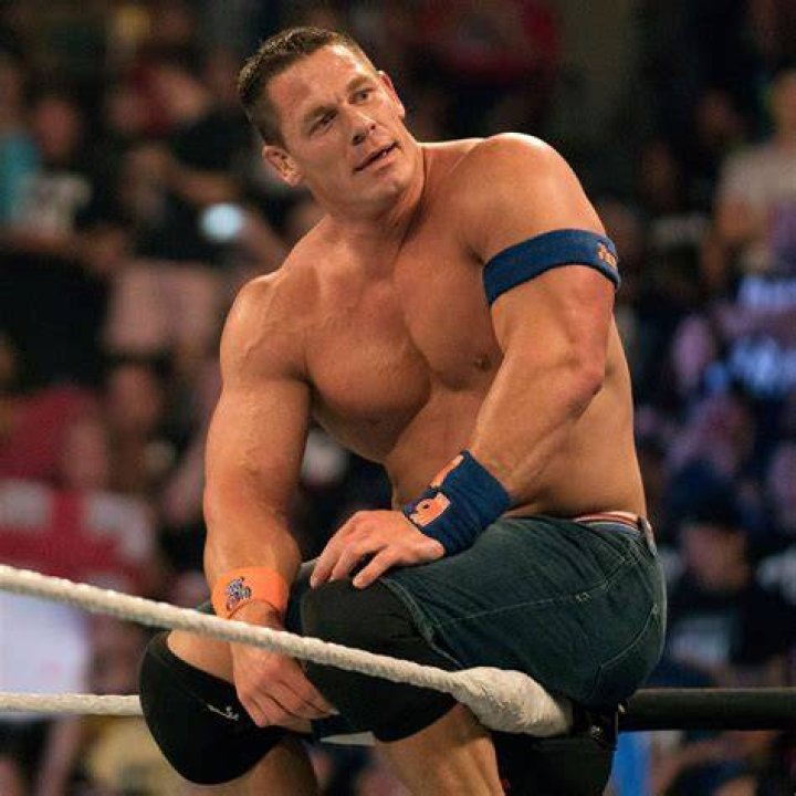 John Cena high fives a character from &lsquo;Ferdinand&rsquo; at the premiere