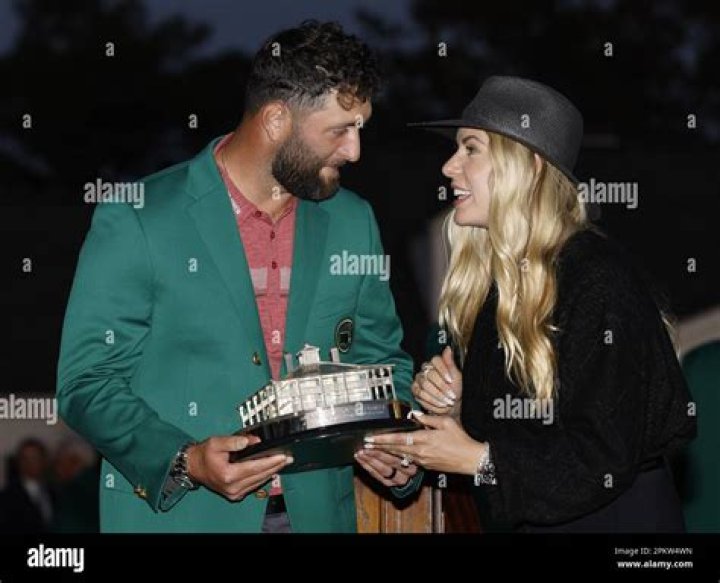 Jon Rahm shares Masters trophy with wife Kelly after the final round at the 87th Masters tournament at Augusta National Golf Club in Augusta, Georgia on Sunday, April 9, 2023. Rahm won the tourney scoring a 12 under par 276. 2023 Masters, Augusta, Georgia, United States - 09 Apr 2023