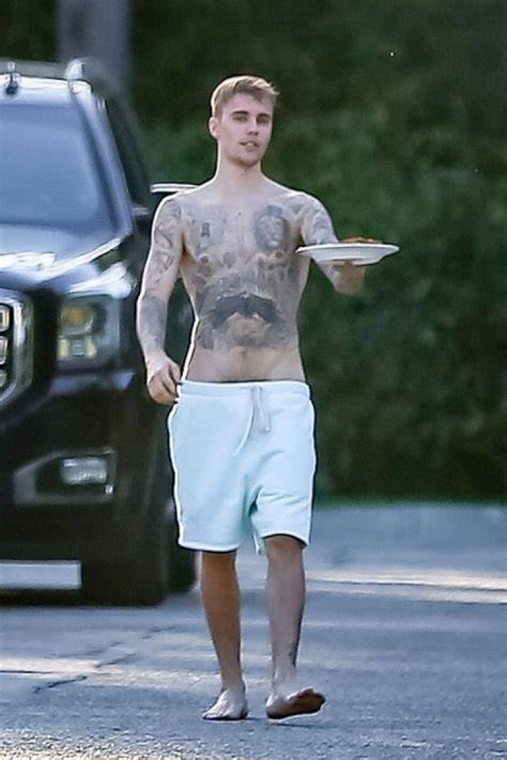 Justin Bieber Goes Shirtless & Shows Off His Muscular Tattooed Body As Wife Hailey Gushes Over Him