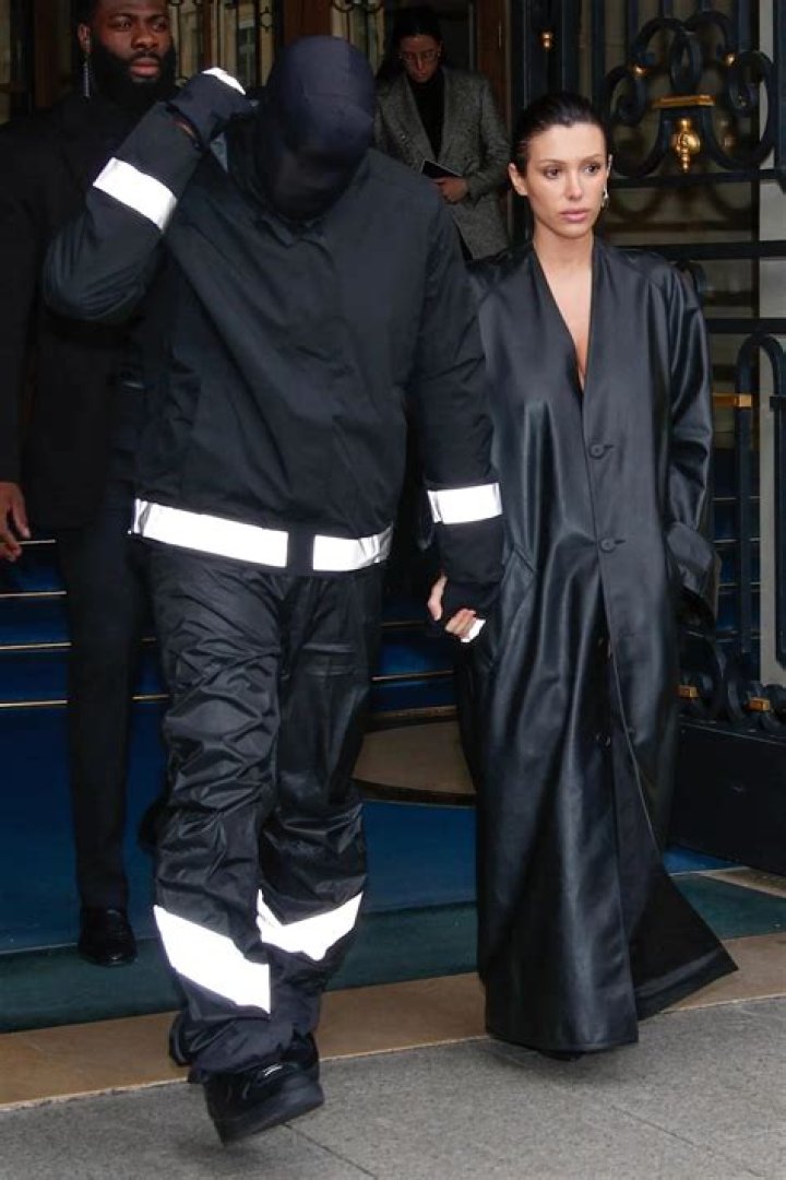 Kanye West & Saint West in a baseball field