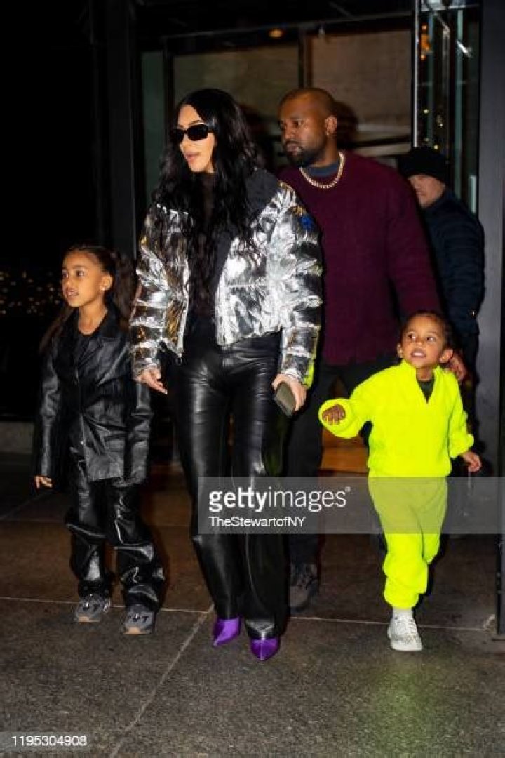 Kanye West and Saint West at a baseball game
