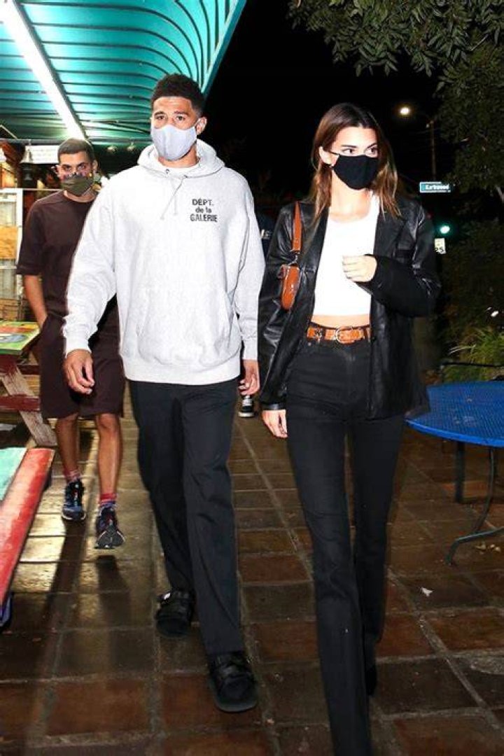 Kendall Jenner Wears BF Devin Booker’s Gold Medal, A Bikini, & Nothing Else On Lake Vacation