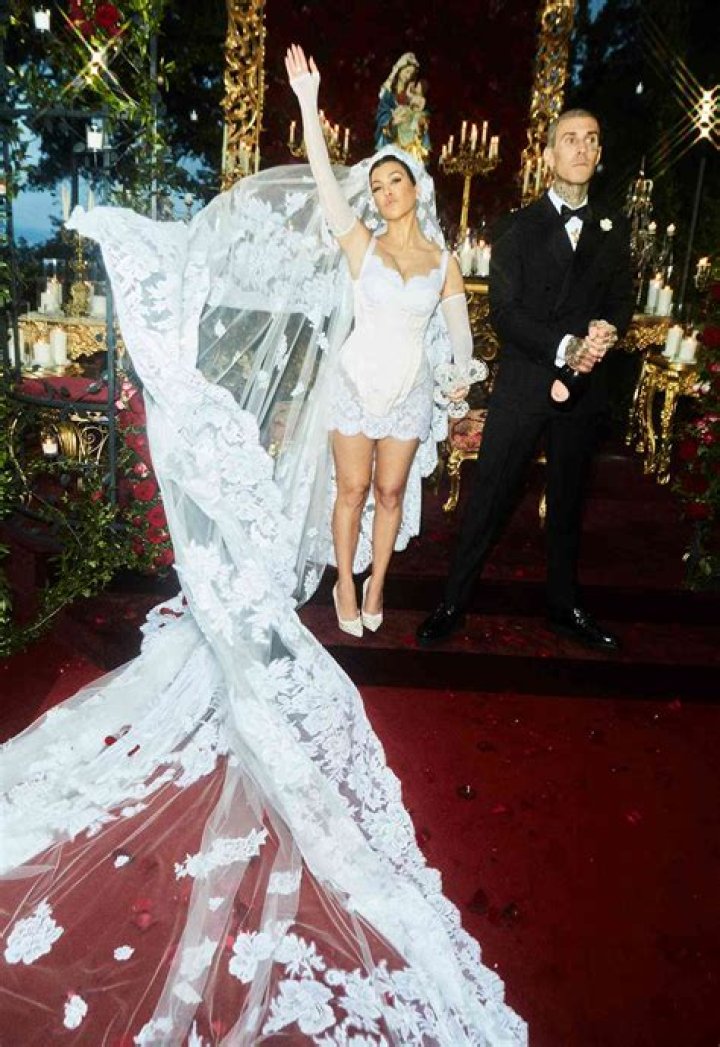 Khloe Kardashian Sizzles In Strapless Mini Dress & Lace Up Boots For Lunch Before Kourtney’s Wedding: Photo