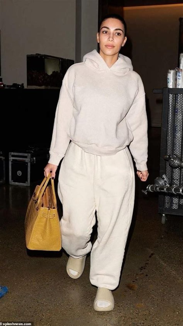 Kim Kardashian In Sweats & Snakeskin Boots