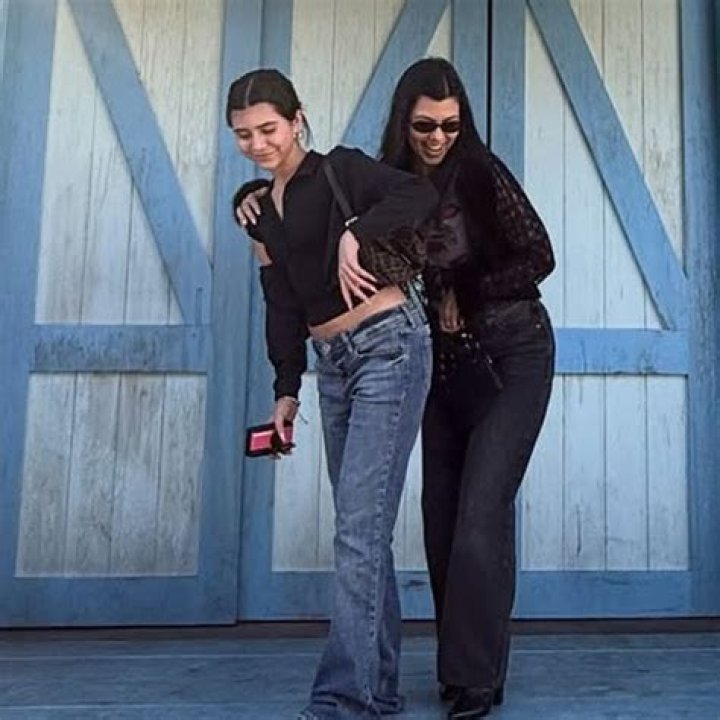 Kourtney Kardashian holds her daughter Penelope&rsquo;s hand and her son Reign on an outing
