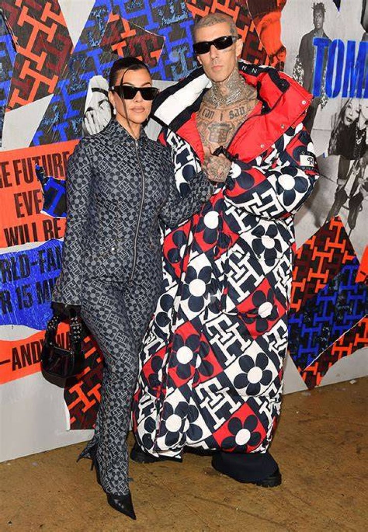 Kourtney Kardashian & Travis Barker Cuddle & Kiss Before His Performance At Tommy Hilfiger NYFW Show