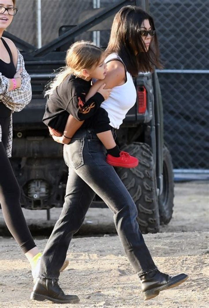Kourtney Kardsahian and Reign Disick walking