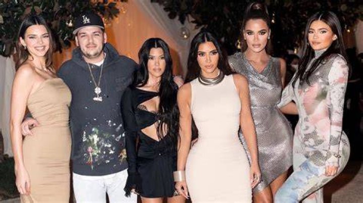 Kylie Jenner, Kim Kardashian, & All The Sisters Reunite For ‘Spice Girls’ Family Pic Crashed By Saint