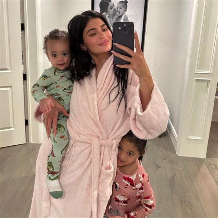Kylie Jenner Twirls To Show Off Her Assets In Clingy Sweater Dress At Malika’s Baby Shower — Watch